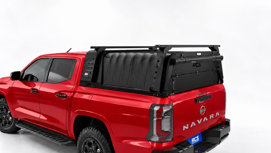 RCS canopy on a Nissan Navara, with roof racks and security screen