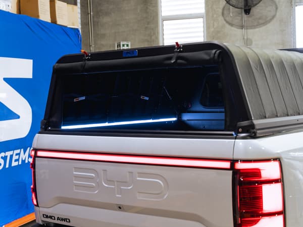 The RCS canopy on a BYD Shark 6 with the LED strip lit