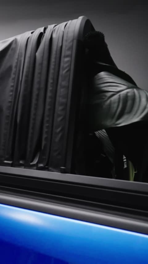 The RCS canopy closed on a blue RAM 1500 in the studio
